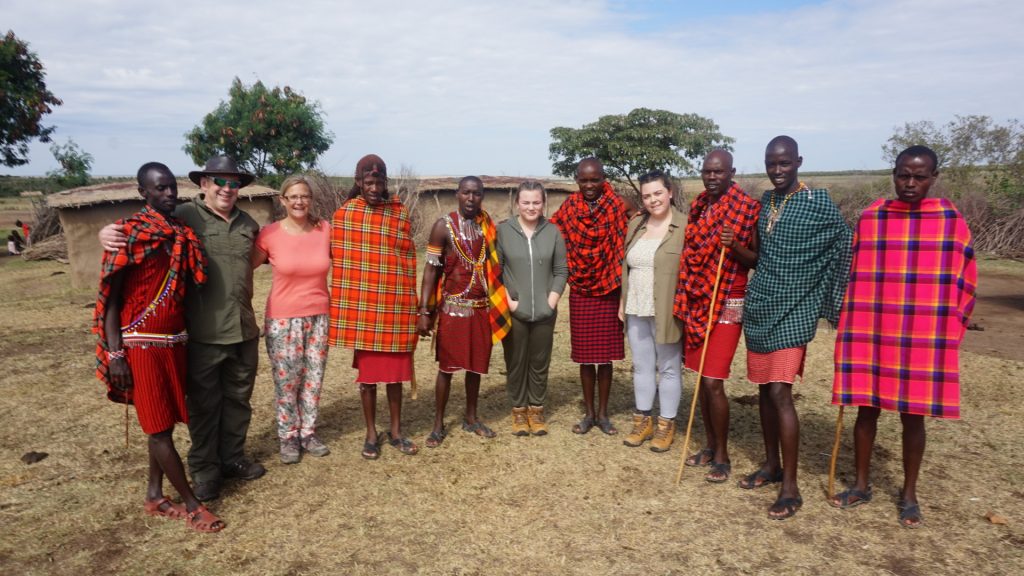 Guests with Masai warriors in the Masai Mara