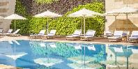 Swimming pol and sun loungers