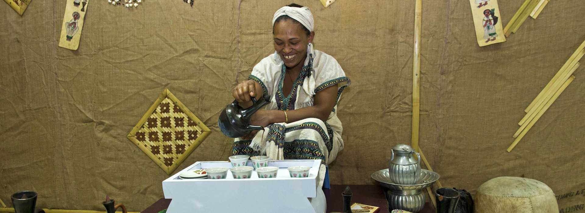 Woman pours coffee in traditional coffee ceremony