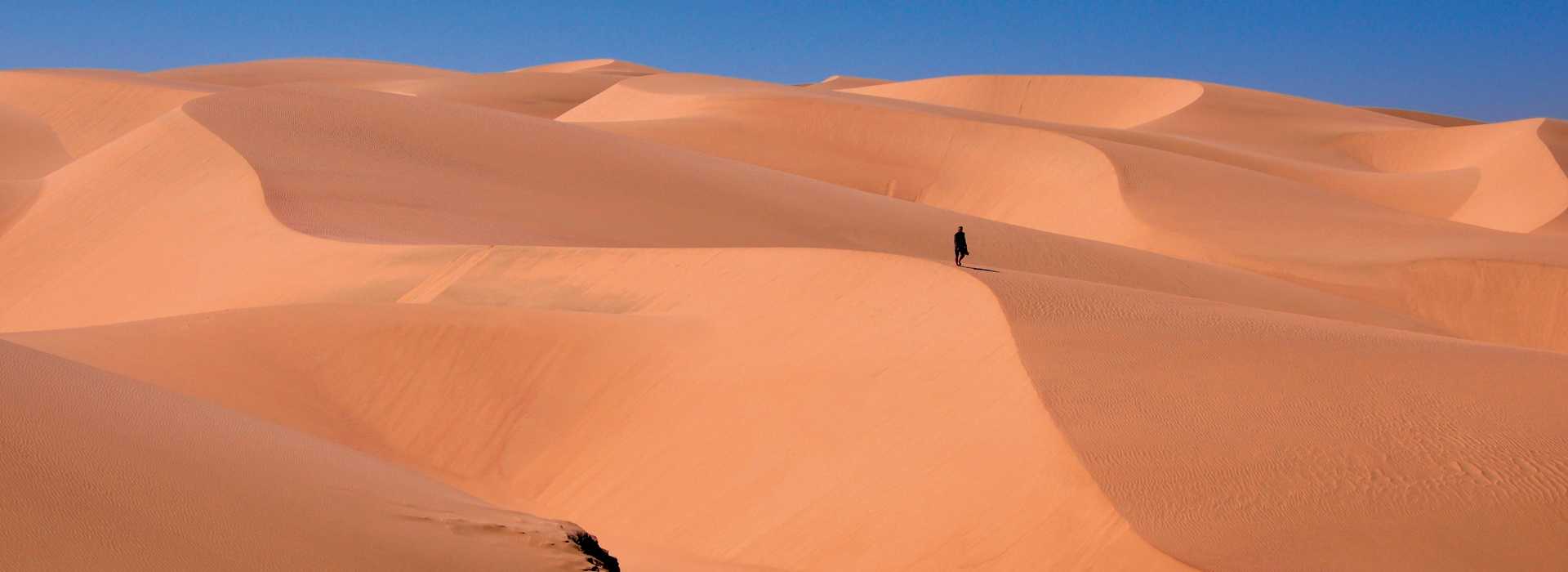 Man climbing the sand dunes at Sossusvlei