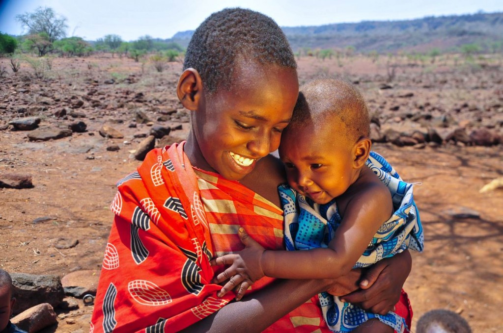 Young girl with baby