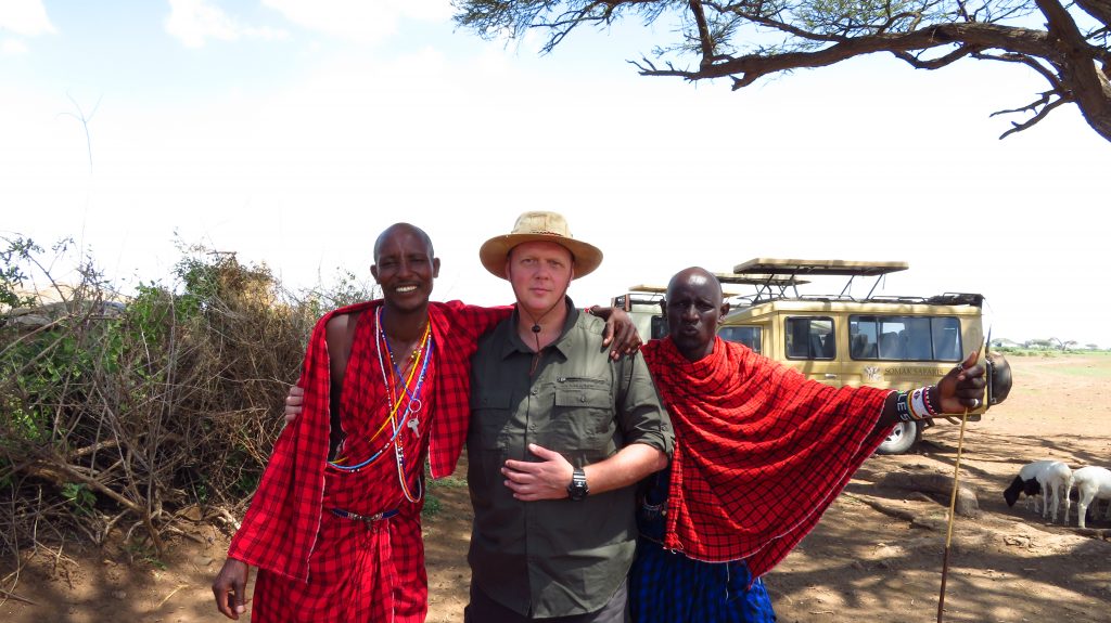 Guest with two Masai warriors