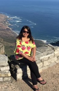 Nishma Gandhi sitting on Table Mountain during a trip to Cape Town, South Africa.