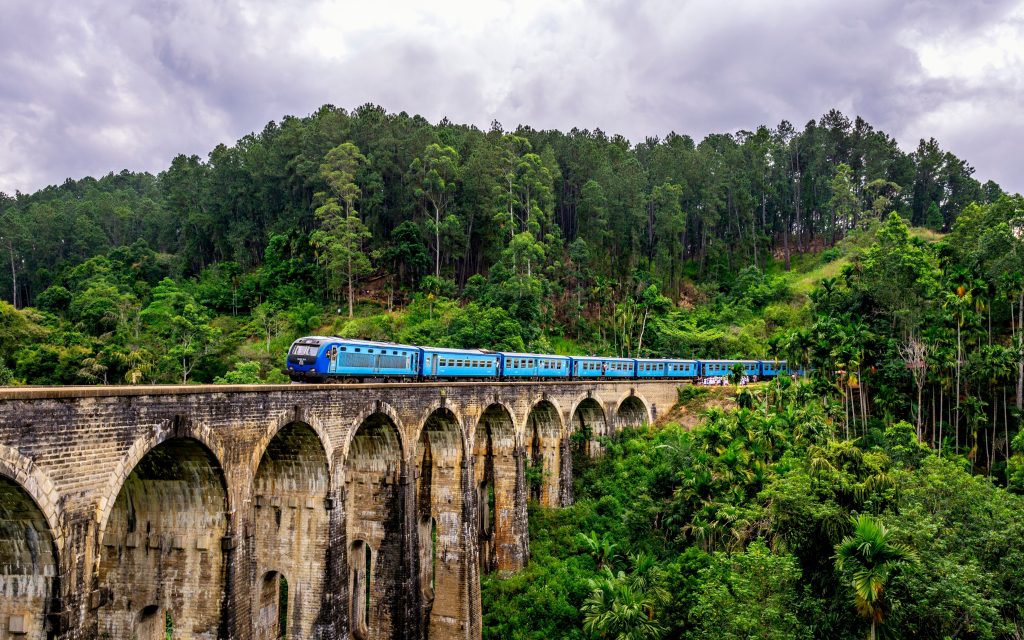 The iconic blue train going over Sri Lanka's Nine Arch Bridge near Demodora between Ella and the end of the line at Badulla.