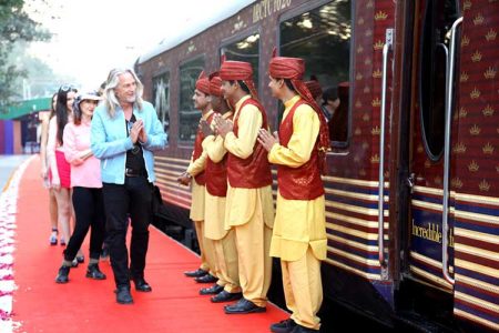 Guests arriving at the Maharaja Express are greeted by staff alongside the train while walking on a red carpet. Source: www.themaharajaexpress.org