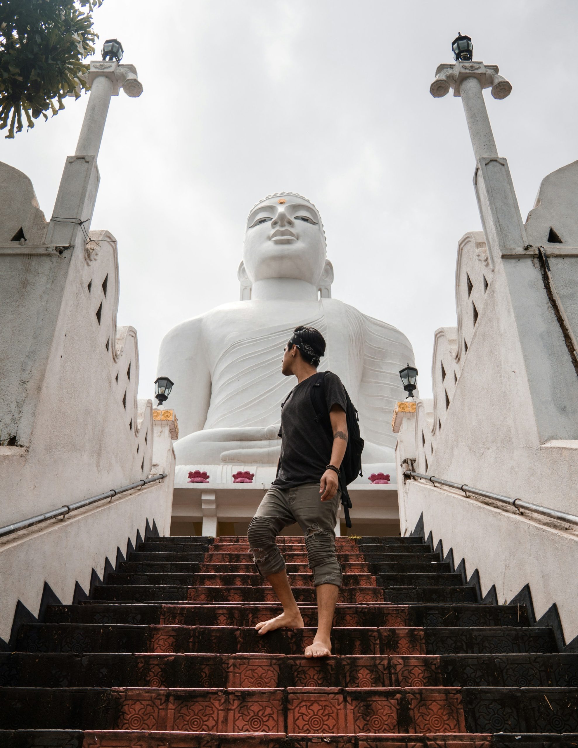 Man walking down a Buddhist temple in Kandy, Sri Lanka