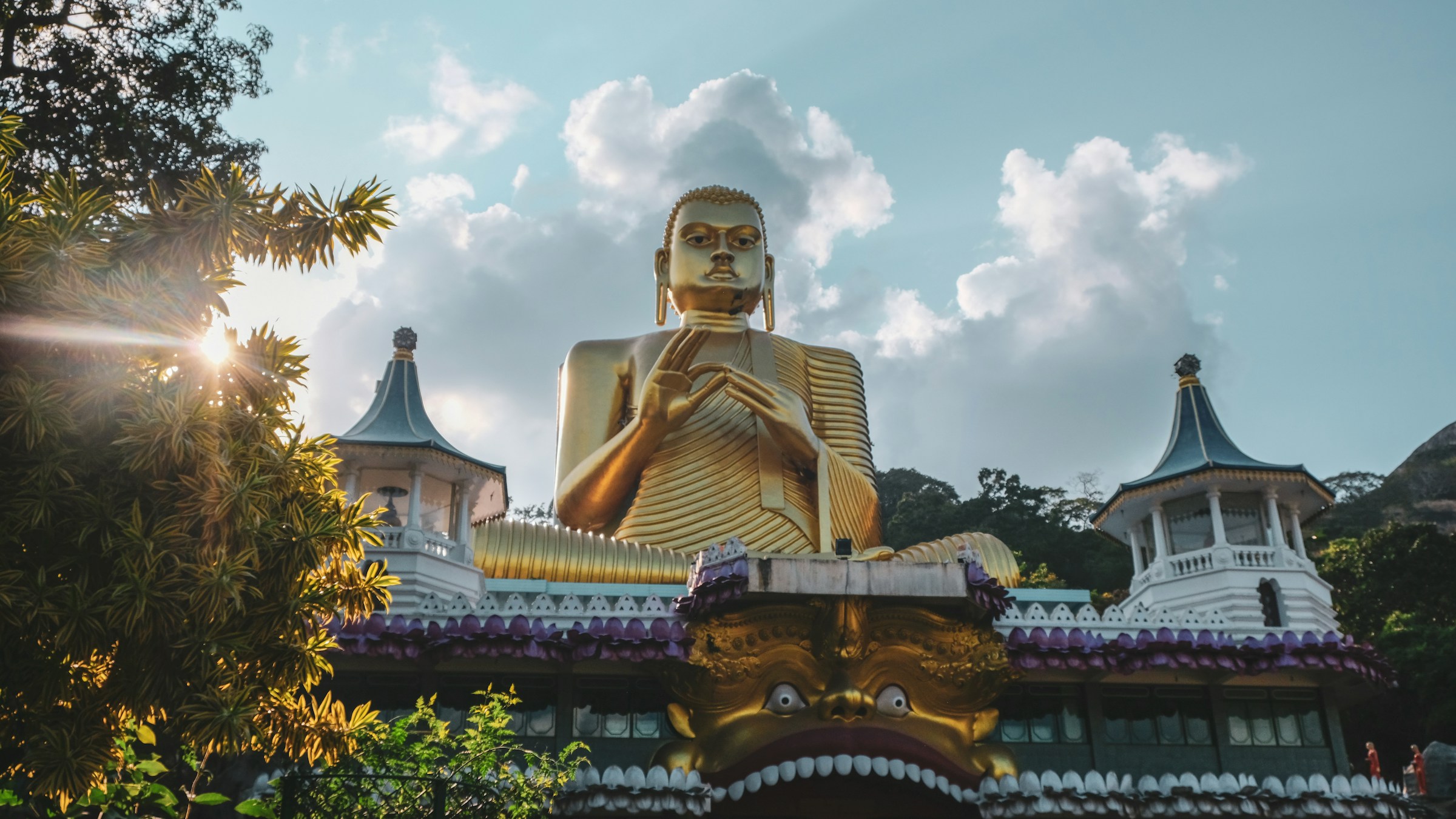 Gold Buddha temple in Sri Lanka at sunset